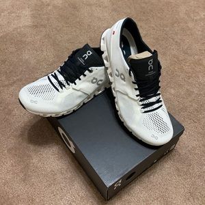 On Cloud X athletic shoes.